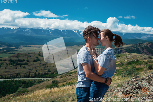 Image of Loving couple together on mountain