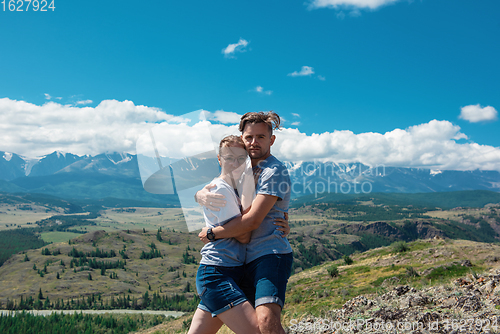 Image of Loving couple together on mountain