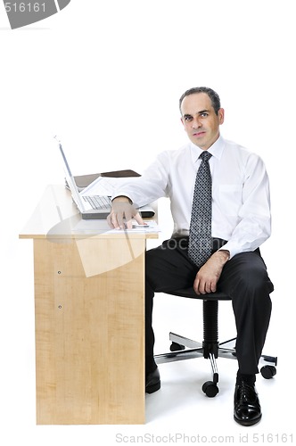 Image of Businessman at his desk on white background