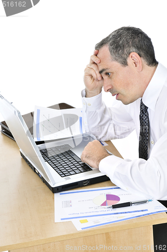 Image of Businessman at his desk on white background