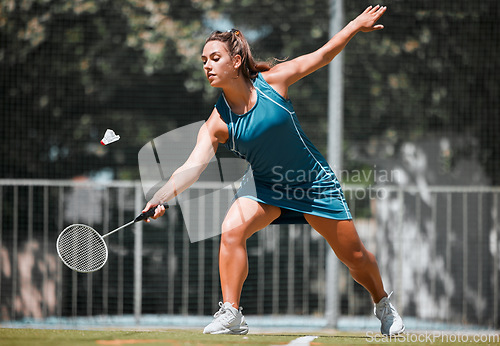 Image of Sports, badminton and woman play game, fitness competition and practice match for outdoor tournament. Exercise, wellness and healthy athlete hit shuttlecock in performance workout on training court