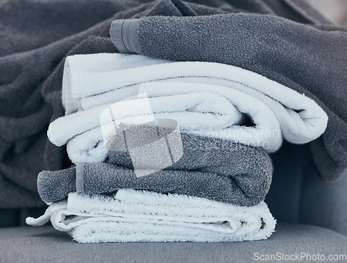 Image of Towels, clean and laundry with texture and fabric for cleaning and hygiene in hospitality or home. Fresh washing, cleaning service or household maintenance closeup with cotton towel and textures.