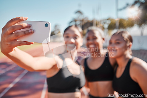 Image of Sports, women and selfie with runner group at a running track for fitness, training and workout outdoors. Friends, phone and girl athlete team bond, smile and take picture at a stadium for exercise