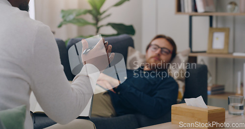 Image of Psychology, mental health and man in a meeting with a psychologist talking, communication and sharing problems. Counseling, support and therapist listening and helping with healing advice in therapy