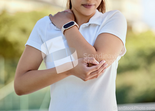 Image of Tennis elbow, sports and a woman with injury, fitness and training game on court. Workout, sport exercise and healthcare, tennis player girl with arm pain or inflammation, accident at outdoor match.