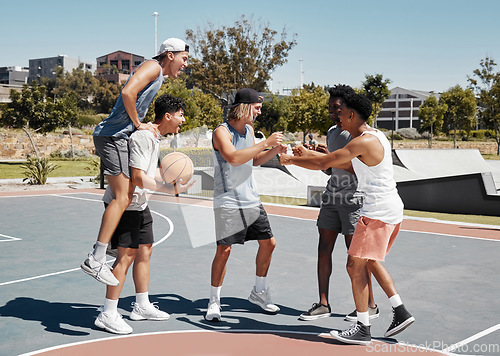 Image of Basketball player, fist bump and friends celebration for training goal, game achievement or teamwork success at outdoor court in urban city park. Group of people or men celebrate on basketball court