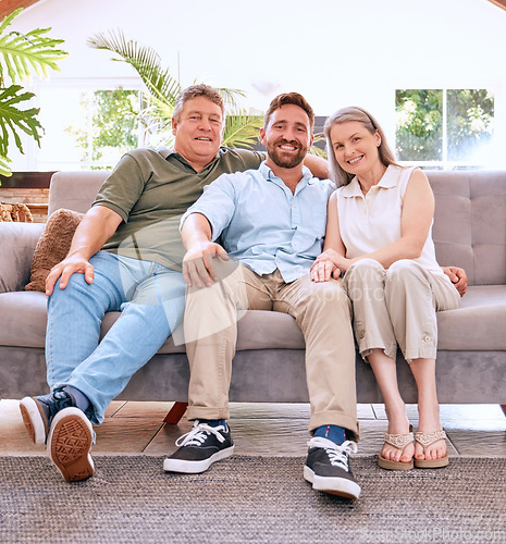 Image of Portrait, mother and father with adult son, happy and bonding together on sofa in living room. Family, mom and dad with grown male child being loving, smile and spend quality time in lounge on couch.