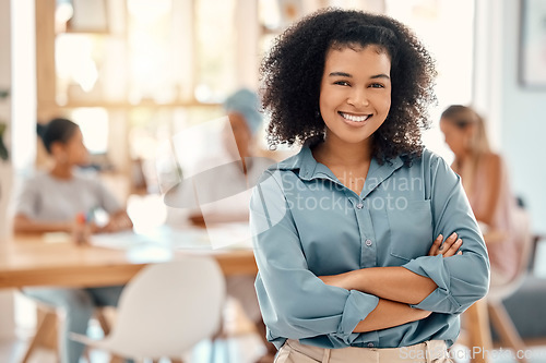 Image of Black woman, leadership smile and meeting with arms crossed in team management, vision or ambition at office. Portrait of a confident creative African female manager smiling for work collaboration