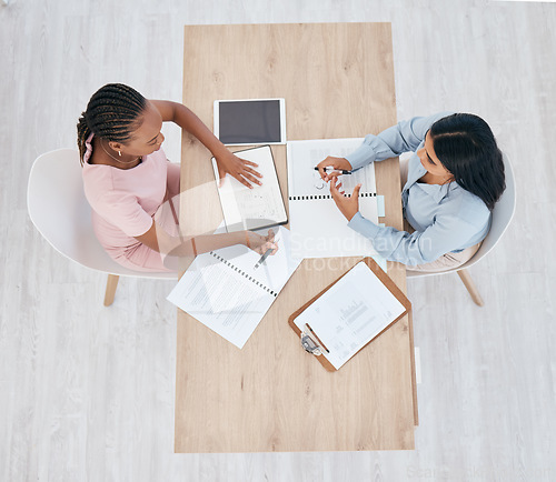 Image of Collaboration, team and women working on data, seo and analytics from above. Teamwork, data and paperwork or documents for digital marketing campaign. Organized, planning and businesswomen brainstorm