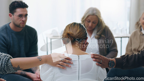 Image of Group therapy, meeting and counseling with people in support to console a woman patient during a session for health. Community, mental health and counselling with a female taking about her emotions