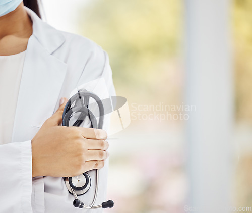 Image of Healthcare, Covid and doctor, woman with stethoscope in hand and boss at hospital or clinic cropped. Help, success and support, confident female medical professional or health care employee at work.