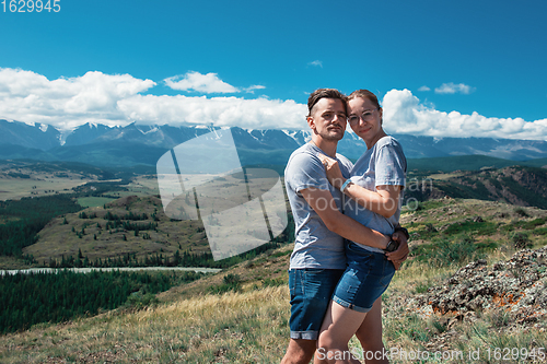 Image of Loving couple together on mountain