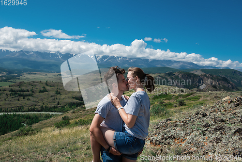 Image of Loving couple together on mountain