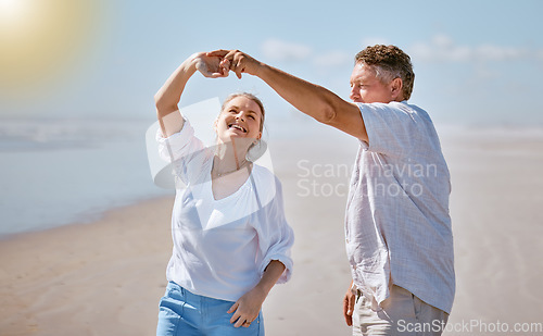 Image of Happy senior couple, dancing and beach for summer vacation, romance or bonding together in the outdoors. Elderly man and woman with smile for romantic dance, anniversary or holiday joy by the ocean
