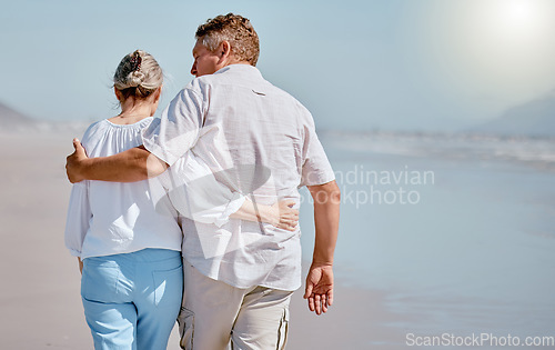 Image of Love, senior couple and beach for walking, vacation and happy being loving together, travel or hug. Romance, mature man and elderly woman embrace on tropical island, relax or seaside sand for holiday