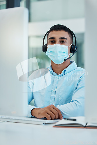 Image of Covid, call center agent or customer service consultant with computer desktop for policy, compliance or insurance IT support. Telemarketing, virtual advisor man portrait consulting with a face mask