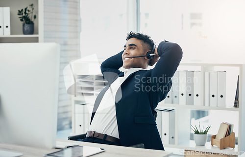 Image of Computer, call center and stretching businessman in relief, success or done crm sales deal, telemarketing goals or crm target. Happy smile, relax and customer support worker hands behind head on tech