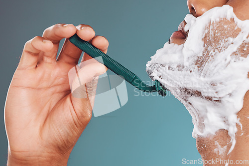 Image of Shaving foam, razor and skincare mockup with man cleaning his face with care for healthy, clean and smooth skin. Male in studio for dermatology, shaved beard and cosmetics for wellness and health