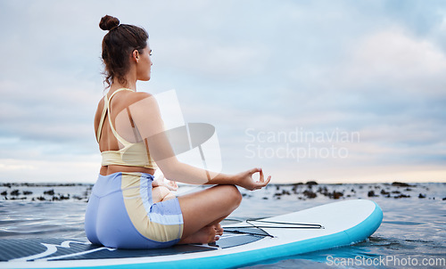 Image of Woman, zen meditation and ocean yoga peace workout exercise for spiritual wellness, healing and soul mindfulness training. Sea breathing, meditate on water and surfer girl breathe for health balance