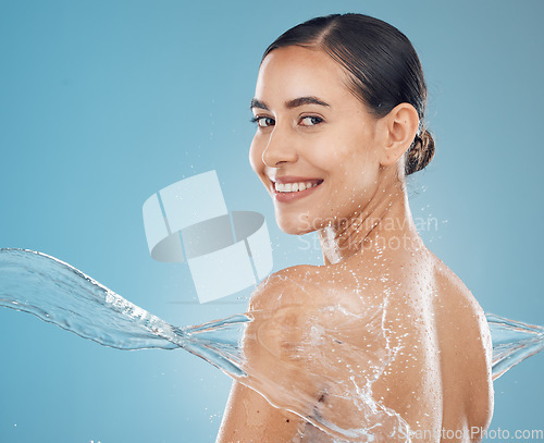 Image of Water, skincare and beauty model splash cleaning skin for body wellness and health from washing. Portrait of a happy and healthy woman from New York with a smile to show happiness and satisfaction
