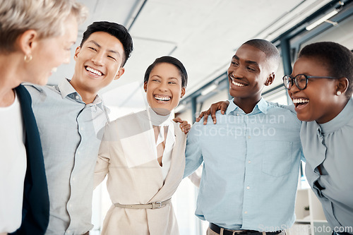 Image of Happy, team building and business people hug in a meeting for successfully coworking in group collaboration. Diversity, teamwork and employees excited in a modern office with goals for growth