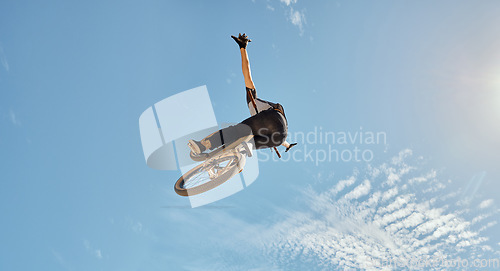 Image of Bicycle stunt, man cycling in air jump on blue sky mock up for sports action performance, fitness training or outdoor bike performance. Professional sports person with bmx bicycle adventure mockup