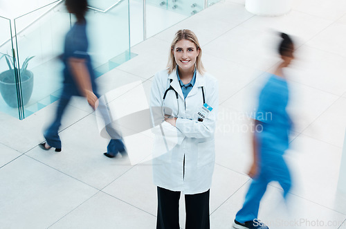 Image of Busy, healthcare and doctor woman in hospital portrait for leadership, trust and leadership with motivation, innovation and proud of career. Business medical professional worker for our vision above