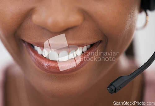 Image of Call center consultant, black woman and smile in closeup of mouth with headset, customer service and support at help desk. Happy telemarketing agent, CRM work and advisory conversation or phone call.