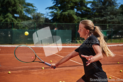 Image of A young girl showing professional tennis skills in a competitive match on a sunny day, surrounded by the modern aesthetics of a tennis court.