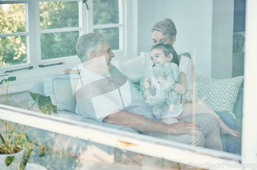 Image of Family, girl with teddy bear and grandmother and grandfather in home, having fun and bonding. Support, care and love of happy grandparents playing with kid holding toy on sofa in house living room.