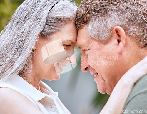 Image of Love hug, forehead and senior couple bond, smile or happy on anniversary vacation for peace, trust or partnership. Romantic eye contact, marriage and elderly man and woman enjoy quality time together