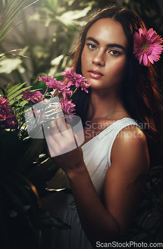 Image of Beauty, flowers and woman in studio for skincare, makeup and product from nature, wellness and leaf cosmetics. Portrait, flower and girl model with jungle, plant and zen, relax and peony aesthetic