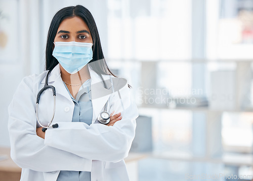 Image of Woman doctor, covid hospital and portrait of young, professional or medical cardiology expert staff working in clinic. Corona virus, female healthcare worker or face mask safety in surgery consulting