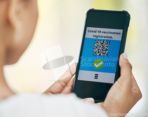 Image of Hand phone, vaccine qr code and covid app on screen with registration for medical passport, barcode for work security or healthcare safety. Woman with travel digital vaccination certificate on mobile