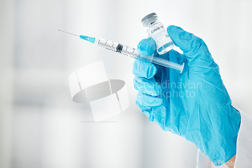 Image of Covid, vaccine and medicine with hands of doctor and syringe for science, pharmacy and medical. Virus, flu and disease with healthcare worker and injection for immunity, treatment and prevention