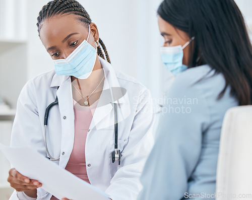 Image of Healthcare, covid and test results of patient woman in hospital with a black doctor wearing face mask during consultation, discussion and diagnosis. Female medical worker talking about covid 19