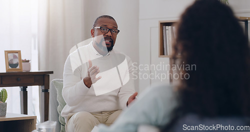 Image of Therapy, support and psychologist talking to a woman about mental health, depression and anxiety. Psychology, healthcare and African therapist with advice for a patient while counseling in an office