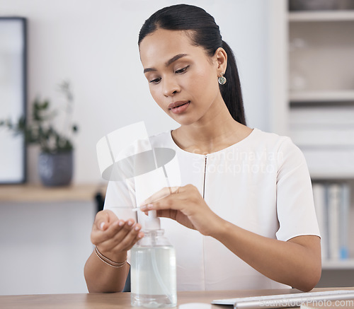 Image of Business woman, hand sanitizer and covid risk management in office for healthcare safety, stop corona virus and cleaning compliance. Worker, liquid bottle product and bacteria protection for wellness