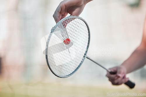 Image of Sports, badminton and shuttlecock with racket and hands of woman training for games, competition and health. Match, workout and exercise with athlete ready to serve for goal, fitness and action