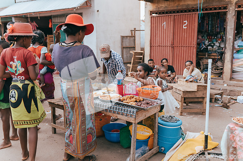 Image of Street food seller on the main street in Miandrivazo. In Madagascar, people usually eat on the street.