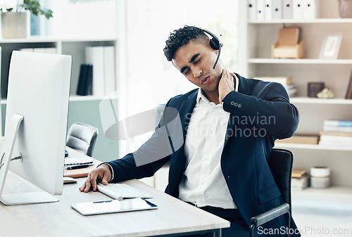 Image of Neck pain, stress and call center businessman health injury, risk and frustrated at agency office desk. Young salesman consultant burnout, joint pain and poor body posture, anxiety and muscle problem