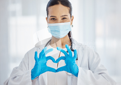 Image of Heart, covid and hands of a doctor with support, love and help in healthcare at hospital. Medicine, insurance and portrait of a nurse with a face mask for virus, care at a clinic and helping at work