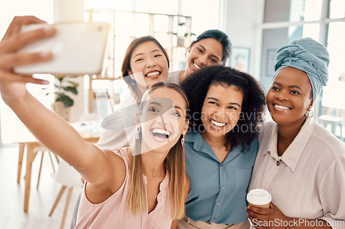 Image of Office, interracial and women phone selfie with happy smile for diversity, friends and team building. Professional and diverse staff at workplace capture photograph on smartphone for social media.
