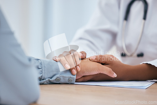 Image of Doctor, patient and holding hands for empathy, trust and hope in consulting, support and healthcare insurance. Kindness, counseling and therapy from medical worker, psychology help and mental health