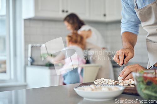 Image of Food, hands and man cooking for family in kitchen with healthy, raw and vegetables in their home. Parents, multitasking and bond with girl while cleaning, talking and prepare a health meal or salad