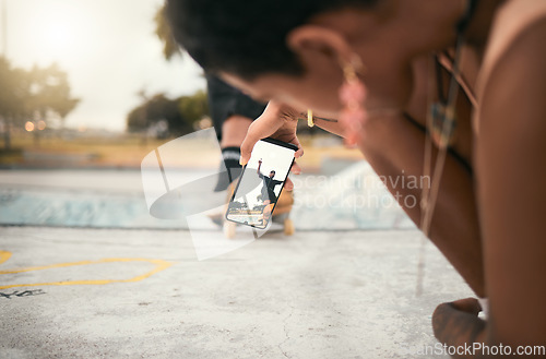Image of Phone, skate and photograph with a woman recording a man skater at the skatepark for fun or recreation. Mobile, skating and picture with a male athlete riding a board while a friend is filming