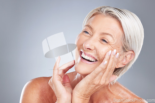 Image of Skincare, beauty and senior woman with smile isolated in gray background studio. Wellness, dermatology and old female with natural skin and wrinkles pose for cosmetics, makeup and skincare products