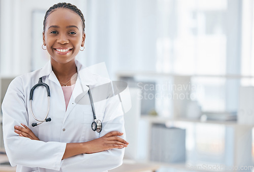 Image of Smile, medical and arms crossed with portrait of doctor and mockup in consulting room for innovation, surgery and medicine. Healthcare, help and vision with black woman in hospital for pandemic virus