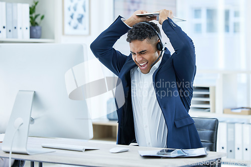 Image of Stress, angry or shouting call center businessman breaking computer keyboard in crm consulting fail, sales deal risk or 404 glitch. Mad, screaming or crazy customer support agent in technology smash