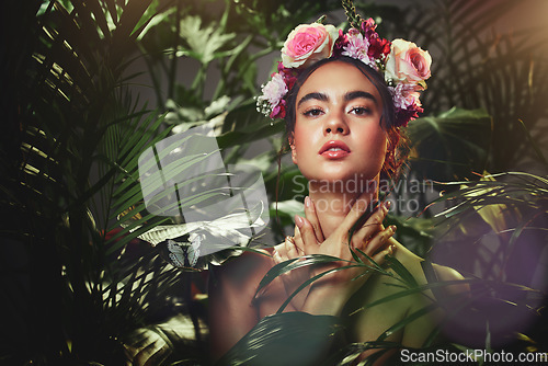 Image of Beauty, rose and crown portrait of woman with tropical palm plants and natural makeup cosmetics. Flowers, headband and beautiful cosmetic model girl in fantasy floral garden touching skin.